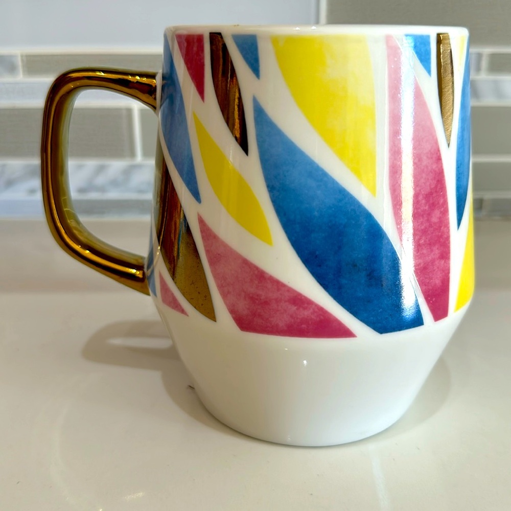 Multi colored leaves design 20 oz white ceramic mug with gold tone handle